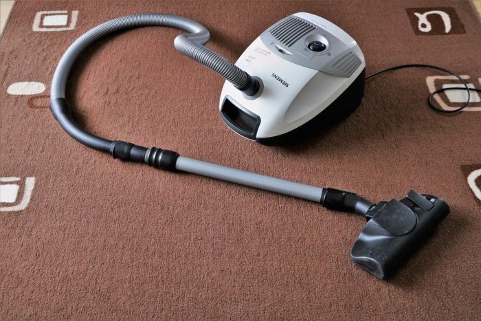 vacuum cleaner on a freshly vacuumed rug