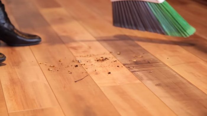 sweeping up crumbs on a laminate floor