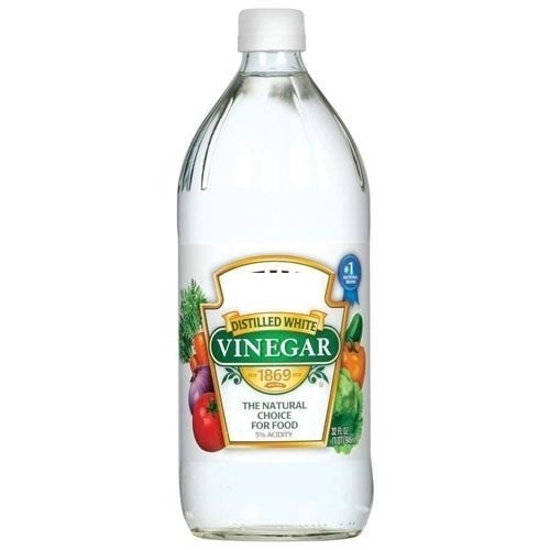 bottle of distilled white vinegar for all natural home cleaning