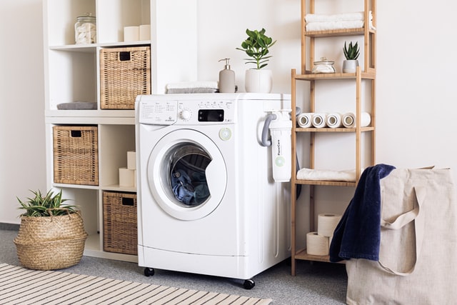 clean white washing machine in a tidy laundry room