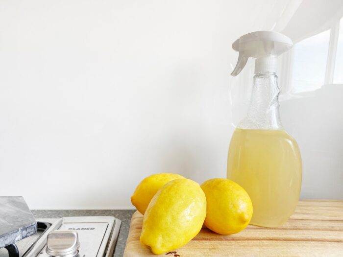 lemons and a cleaning spray bottle